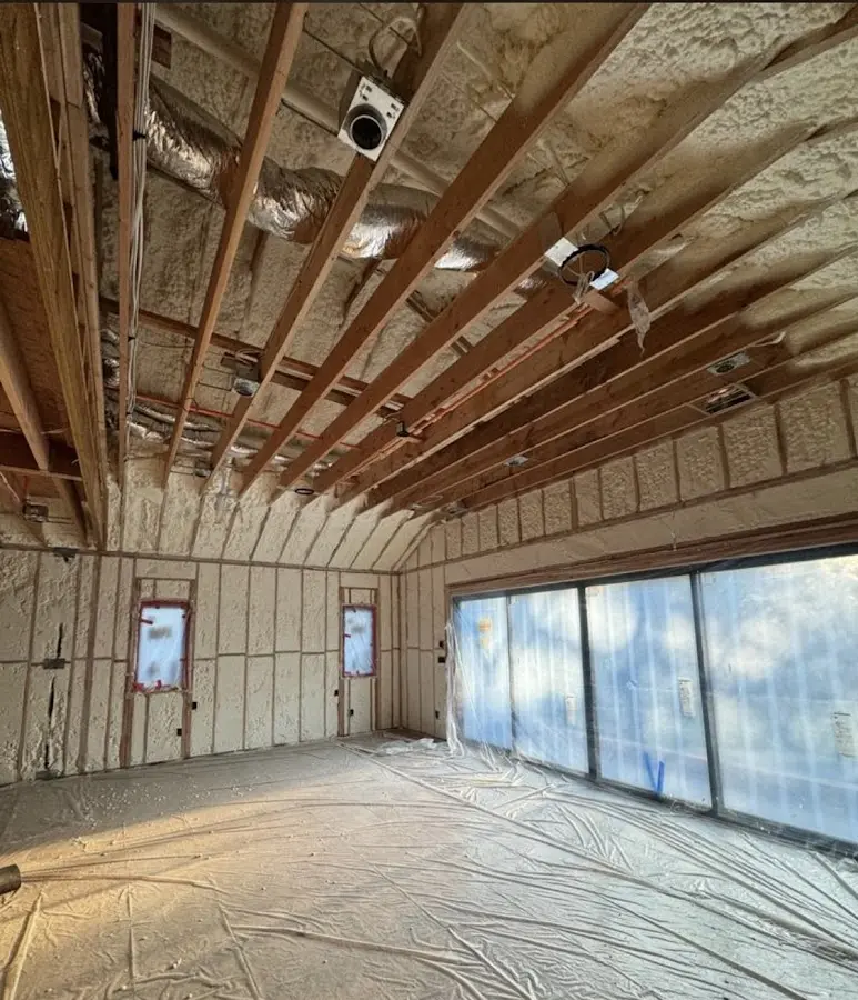Interior walls and ceiling insulated with spray foam during new construction in Lower Windsor